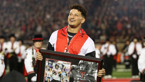Oct 29, 2022; Lubbock, Texas, USA; Kansas City Chiefs quarterback Patrick Mahomes II watches as his name is unveiled during his induction in the Ring of Honor at half-time of a game between the Texas Tech Red Raiders and the Baylor Bears at Jones AT&T Stadium and Cody Campbell Field. Mandatory Credit: Michael C. Johnson-USA TODAY Sports